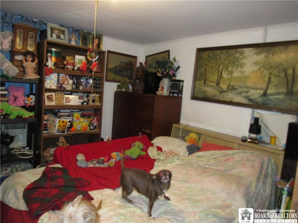 bedroom with ornamental molding