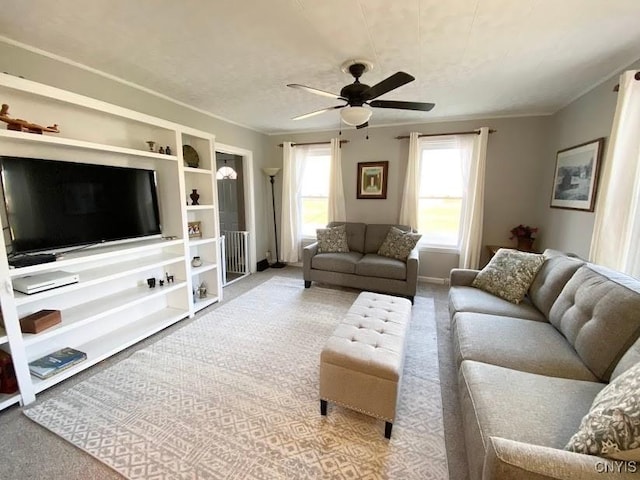 living room with ceiling fan and light colored carpet