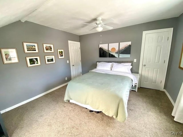 carpeted bedroom featuring ceiling fan and vaulted ceiling