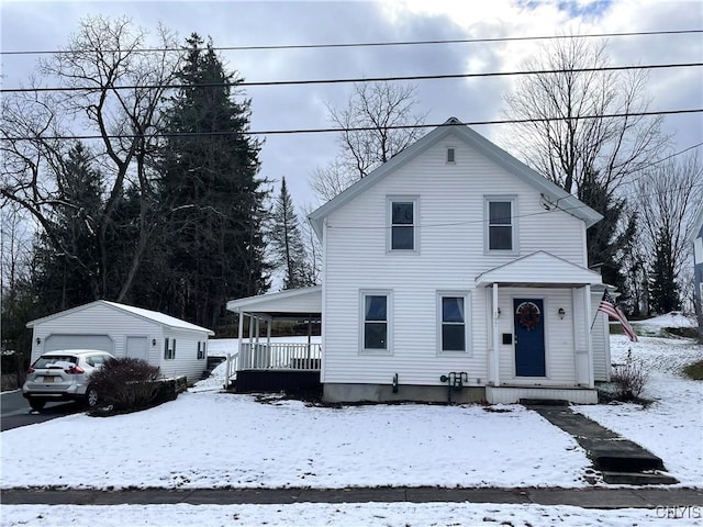 view of front of home with a porch and an outdoor structure