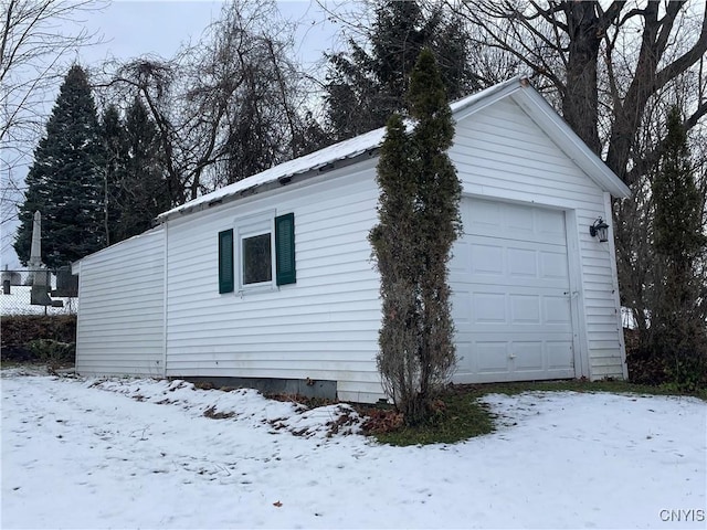 view of snow covered garage