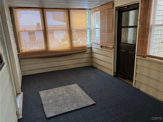 unfurnished sunroom featuring plenty of natural light