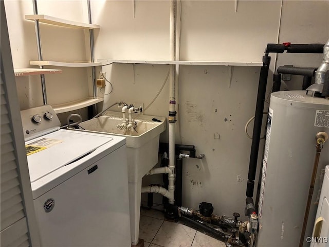 laundry room with washer / clothes dryer, light tile patterned floors, and gas water heater