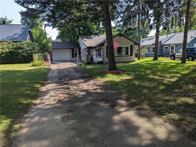 single story home featuring a front yard and a garage