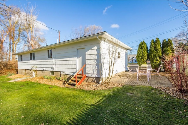 exterior space featuring a yard and a patio