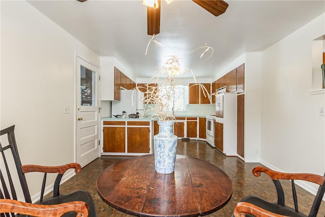 dining space featuring ceiling fan