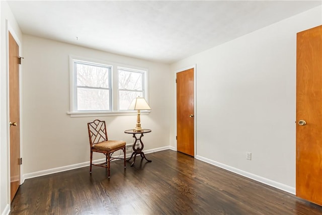 sitting room featuring dark hardwood / wood-style flooring