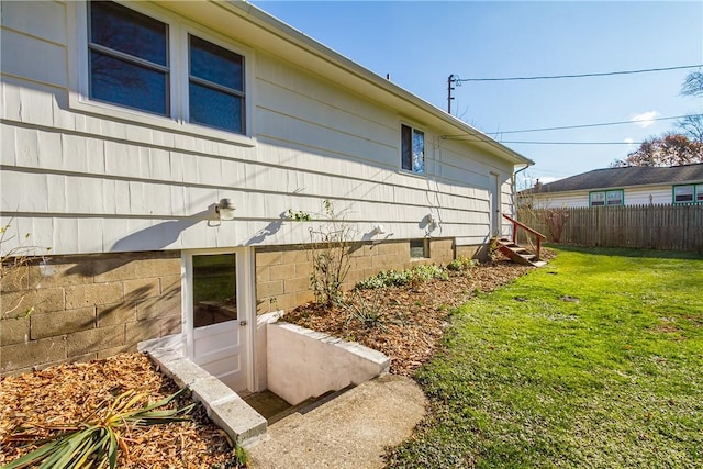 view of side of home featuring a yard