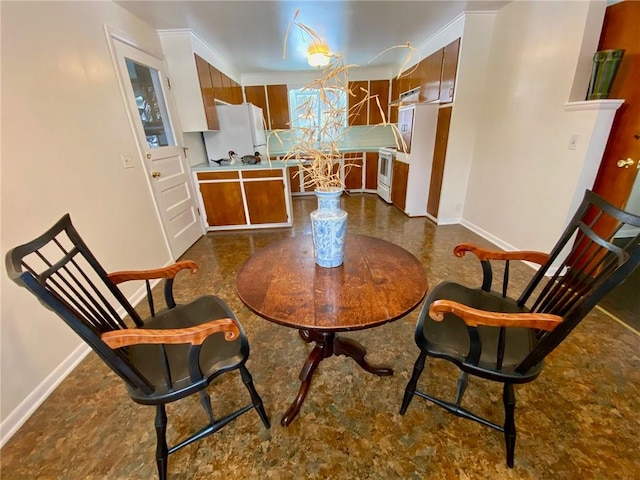 dining room featuring crown molding