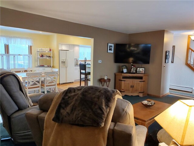 living room featuring a baseboard heating unit