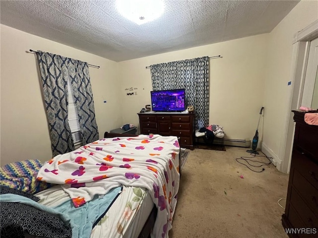 carpeted bedroom featuring a textured ceiling