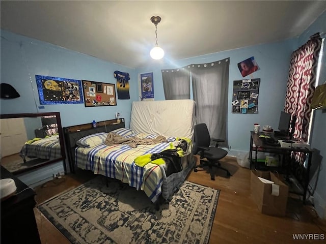 bedroom featuring hardwood / wood-style floors