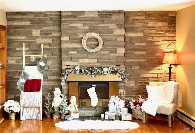 interior details featuring hardwood / wood-style floors and a baseboard heating unit