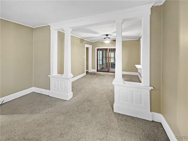 spare room with carpet flooring, ceiling fan, and crown molding