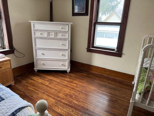 bedroom featuring dark wood finished floors