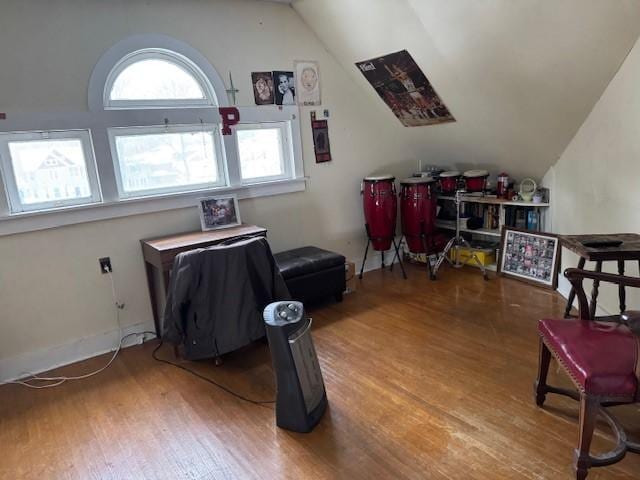 interior space featuring vaulted ceiling and wood finished floors