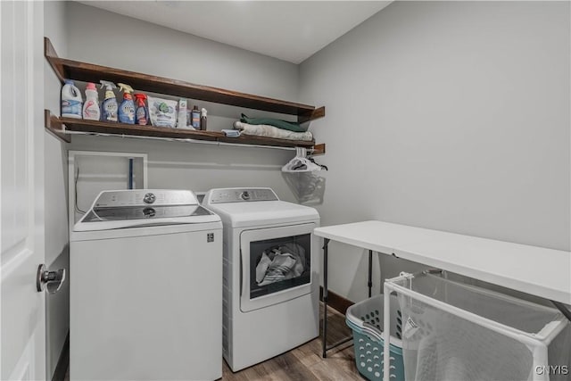 washroom with light hardwood / wood-style floors and separate washer and dryer