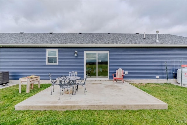 back of house featuring a lawn, a patio area, and central AC unit