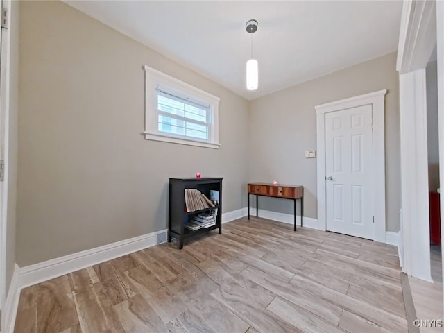 spare room featuring light hardwood / wood-style floors