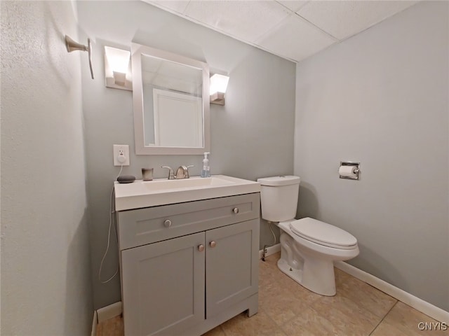 bathroom featuring tile patterned floors, vanity, and toilet