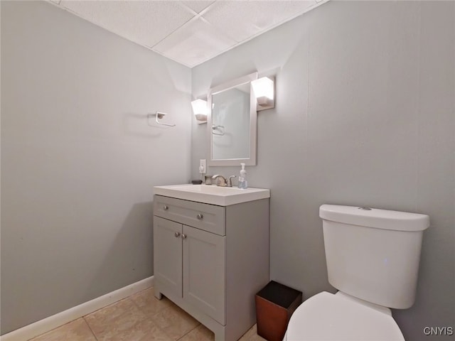 bathroom featuring tile patterned floors, vanity, and toilet