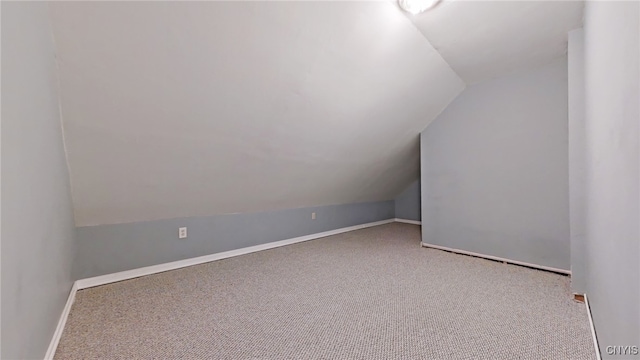 bonus room featuring carpet flooring and lofted ceiling