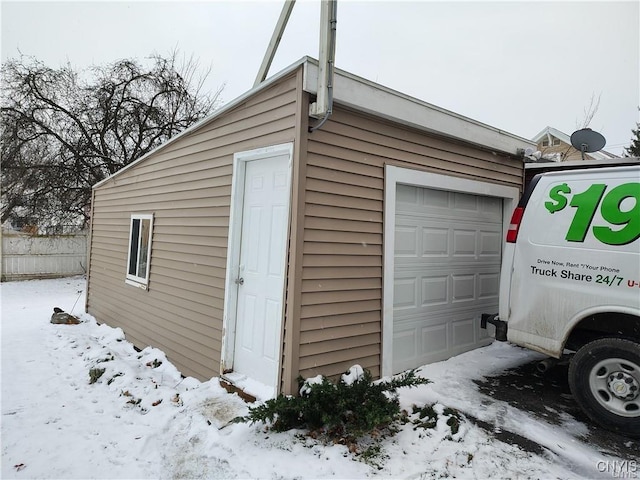 view of snow covered garage