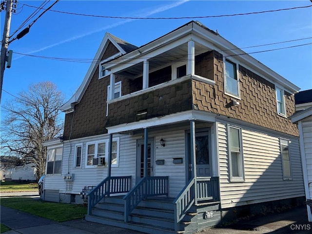 view of front of home featuring a shingled roof