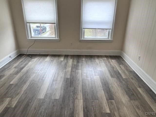 spare room featuring dark hardwood / wood-style flooring