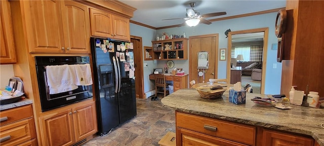 kitchen with light stone countertops, ornamental molding, ceiling fan, black appliances, and a baseboard radiator