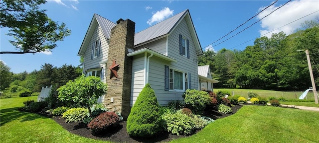 view of home's exterior featuring a yard