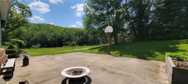 view of patio / terrace with a fire pit