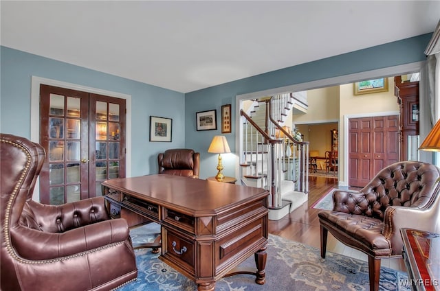 home office featuring french doors and hardwood / wood-style flooring