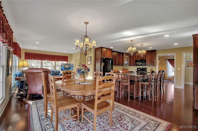 dining area featuring dark wood-type flooring and a chandelier