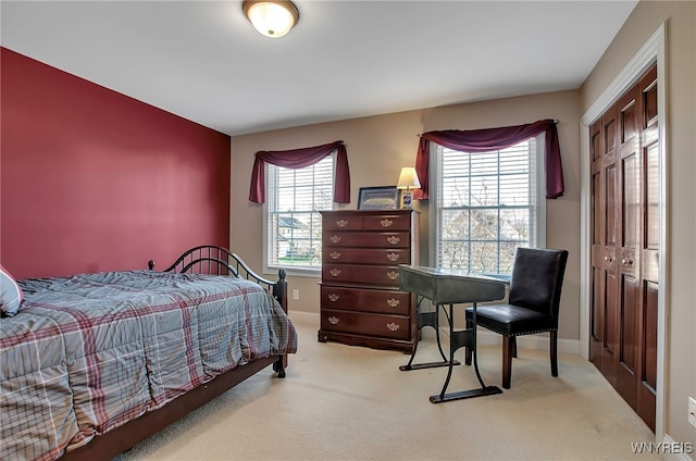 carpeted bedroom with a closet