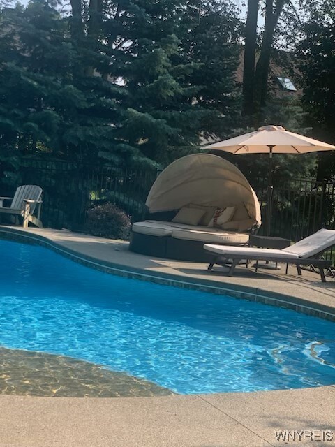 view of swimming pool featuring a patio area