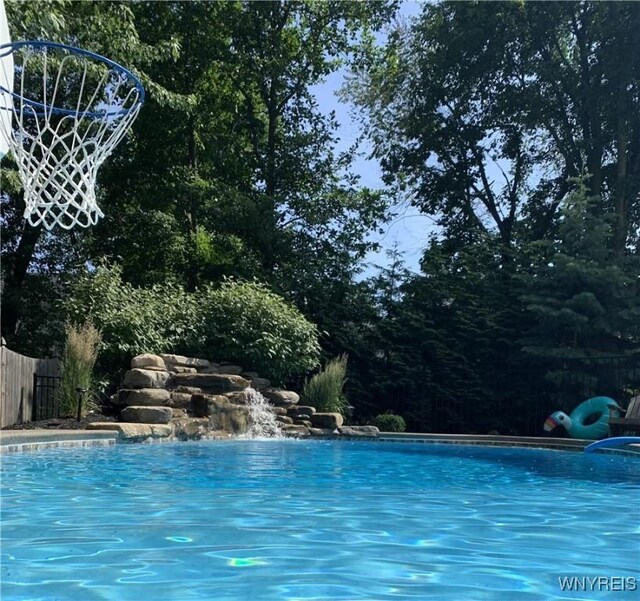 view of pool featuring pool water feature