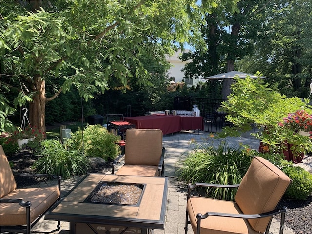 view of patio with an outdoor fire pit