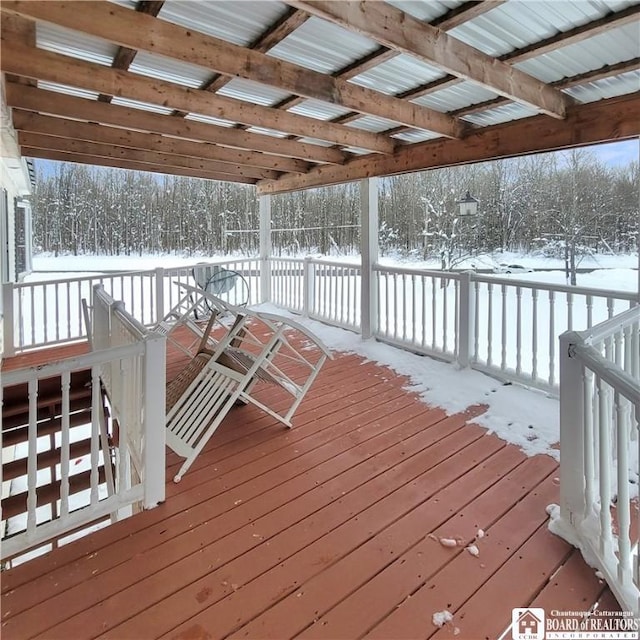 view of snow covered deck