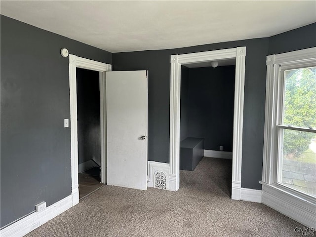 unfurnished bedroom with carpet floors