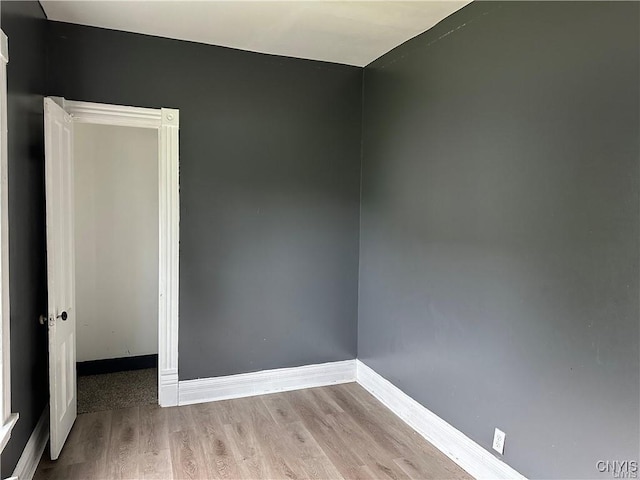 unfurnished room with light hardwood / wood-style floors