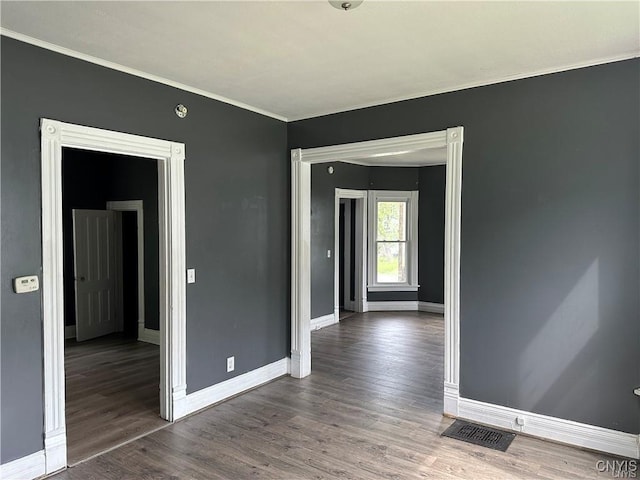 unfurnished room featuring dark hardwood / wood-style flooring