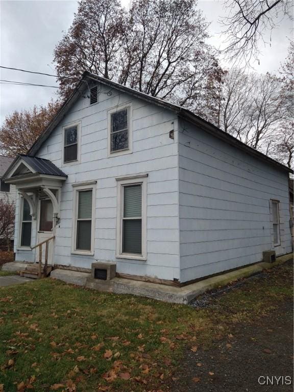 view of property exterior featuring a yard