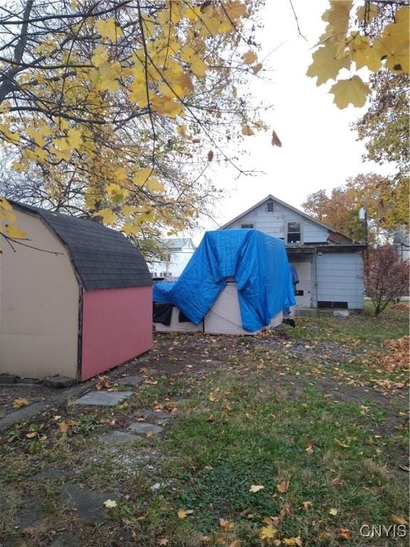 exterior space with a storage shed