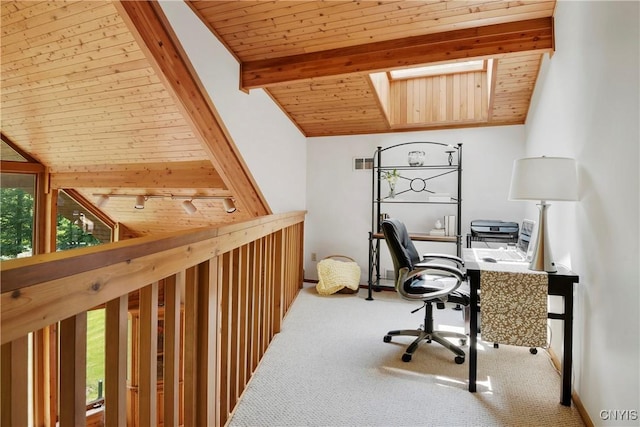 office area featuring vaulted ceiling with skylight, carpet floors, and wooden ceiling