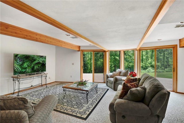 living room featuring carpet and beam ceiling