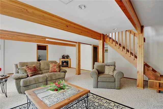 living room with beamed ceiling and carpet floors