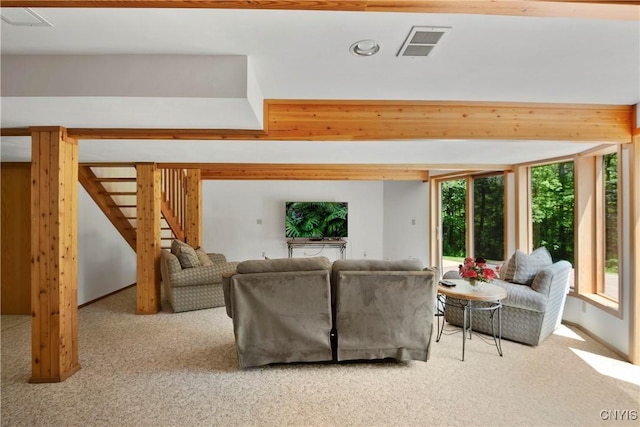 living room with light colored carpet and a healthy amount of sunlight