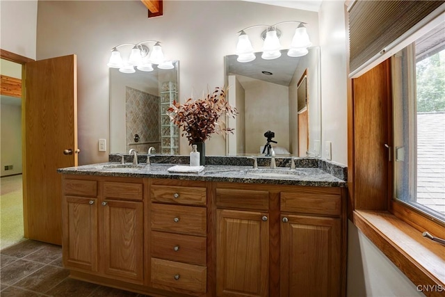 bathroom featuring tile patterned flooring and vanity