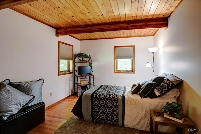 bedroom featuring wooden ceiling, multiple windows, and light hardwood / wood-style flooring